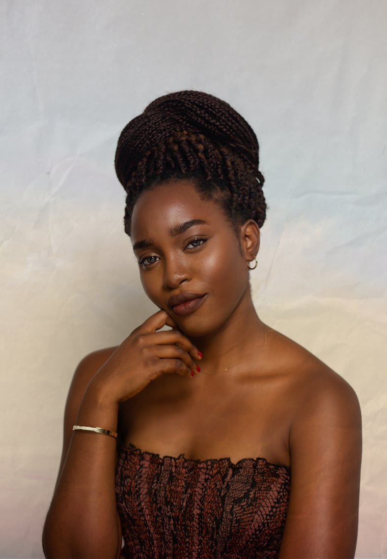 Charming black woman looking at camera